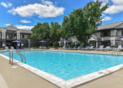 Thumbnail 14 of 30 - our apartments have a large pool with chairs and umbrellas