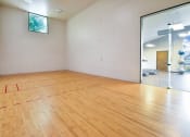 Thumbnail 38 of 43 - an empty room with a racquetball court  at Riverset Apartments, Tennessee