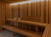 Thumbnail 57 of 83 - A wooden sauna with benches and towels.