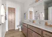 Thumbnail 10 of 83 - a bathroom with a sink and a mirror and a toilet