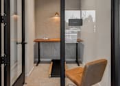 Thumbnail 68 of 83 - A room with a desk and a chair.
