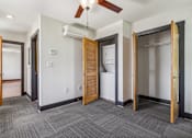 Thumbnail 6 of 7 - an empty room with two doors and a laundry room
