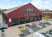 Thumbnail 1 of 17 - A red brick building with the words Cary St. Station on the front.