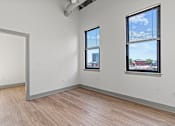Thumbnail 6 of 20 - A room with a white wall and a window with blinds.