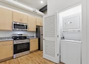 Thumbnail 12 of 22 - A kitchen with wooden cabinets and a white fridge.