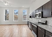 Thumbnail 2 of 9 - Photo of kitchen and living space facing Broad Street in Richmond, Virginia