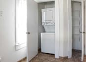 Thumbnail 5 of 8 - A white oven and dishwasher in a kitchen.