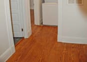 Thumbnail 16 of 22 - A white oven in a kitchen with wooden floors.