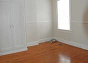 Thumbnail 13 of 22 - A room with a ceiling fan and a window.