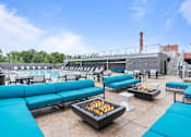 Thumbnail 2 of 17 - Image of fire pit surrounded by blue sofas