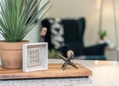 Thumbnail 8 of 39 - a wooden tray with a starfish and a picture on it on a counter next to a at The Bend Arbordale, Virginia, 23188