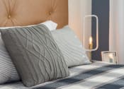 Thumbnail 2 of 39 - a bedroom with a bed with two pillows and a lamp on the side of the bed at The Bend Arbordale, Williamsburg, 23188