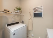 Thumbnail 16 of 39 - a laundry room with a washer and dryer at The Bend Arbordale, Williamsburg, VA