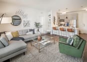 Thumbnail 4 of 29 - Living room with breakfast bar in the kitchen at Parc at Princeton Junction Apartments, New Jersey, 08540