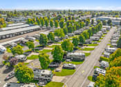 Thumbnail 1 of 15 - an aerial view of a parking lot filled with parked rvs
