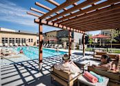 Thumbnail 30 of 39 - Swimming Pool and Sun Deck at 8000 Uptown Apartments, Broomfield, Colorado