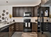Thumbnail 2 of 34 - Kitchen at West Line Flats Apartments in Lakewood, CO