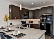 Thumbnail 4 of 34 - Kitchen at West Line Flats Apartments in Lakewood, CO