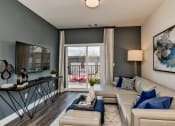 Thumbnail 7 of 34 - Living Room With TV at West Line Flats Apartments in Lakewood, CO