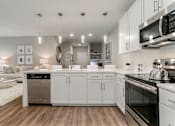 Thumbnail 3 of 37 - a spacious kitchen with white cabinets and stainless steel appliances at Annandale Apartment Homes, Murfreesboro, 37128