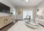 Thumbnail 8 of 37 - a living room with a white rug and a white couch at Annandale Apartment Homes, Tennessee 37128