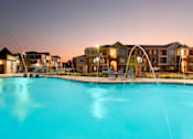 Thumbnail 27 of 37 - a large swimming pool with an apartment building in the background at Annandale Apartment Homes, Murfreesboro