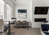 Thumbnail 21 of 37 - a dining room with a table and chairs and a fireplace at Annandale Apartment Homes, Tennessee