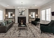 Thumbnail 18 of 37 - a living room with a couch and chairs and a fireplace at Annandale Apartment Homes, Murfreesboro, 37128