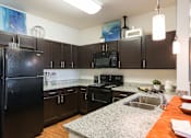 Thumbnail 5 of 27 - Kitchen at Arterra Place Apartments, Aurora