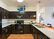Thumbnail 4 of 27 - Gourmet Kitchen at Arterra Place Apartments, Aurora, Colorado