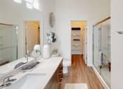 Thumbnail 7 of 48 - A bathroom with a white sink and a mirror.