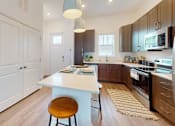 Thumbnail 6 of 57 - Kitchen with Wooden Floors at Artesia at Lakewood Ranch Apartments, Florida