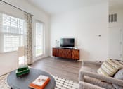 Thumbnail 8 of 57 - Living Room with a Grey Couch at Artesia at Lakewood Ranch Apartments, Bradenton