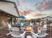 Thumbnail 25 of 33 - back patio with fire pit by the leasing office at Onyx at Westgate Apartments, Arizona