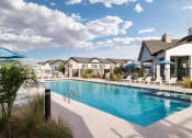 Thumbnail 29 of 33 - pool view and patio at Onyx at Westgate Apartments, Arizona, 85305