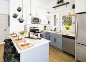 Thumbnail 11 of 33 - Kitchen at Onyx at Westgate Apartments, Arizona, 85305