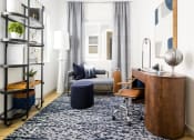 Thumbnail 14 of 33 - office space with blue rug at Onyx at Westgate Apartments, Glendale, 85305