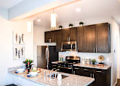Thumbnail 4 of 31 - Kitchen at Black Feather Apartments in Castle Rock, CO