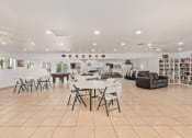 Thumbnail 12 of 26 - a large room with white tables and chairs