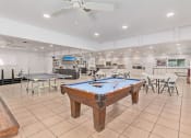 Thumbnail 11 of 26 - a recreation room with a pool table and ping pong