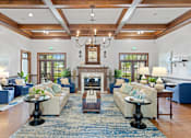 Thumbnail 22 of 40 - a living room filled with furniture and a fireplace