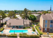 Thumbnail 16 of 24 - an aerial view of an apartment complex with a swimming pool