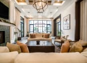 Thumbnail 19 of 35 - a living room filled with furniture and a fireplace at The Lotus at Village Walk, Fort Myers, 33966