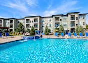 Thumbnail 33 of 47 - Swimming Pool With Relaxing Sundecks at WestLink at Oak Station Apartments, Colorado