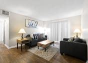 Thumbnail 10 of 29 - a living room with a couch and a table at Diamond  Trail Apartments, Oklahoma City