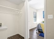 Thumbnail 10 of 24 - spacious closet with white clothes hanger