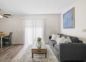Thumbnail 4 of 24 - grey couch and small table in living room