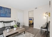 Thumbnail 6 of 24 - grey couch and small table in living room