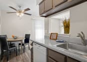 Thumbnail 1 of 24 - kitchen and dining area with fan