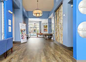 Thumbnail 22 of 48 - clubhouse with wood flooring at Westlink at Oak Station Apartments in Lakewood, CO